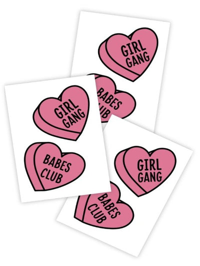 Two pink side by hearts that feature the words girl gang and babes club in the centre